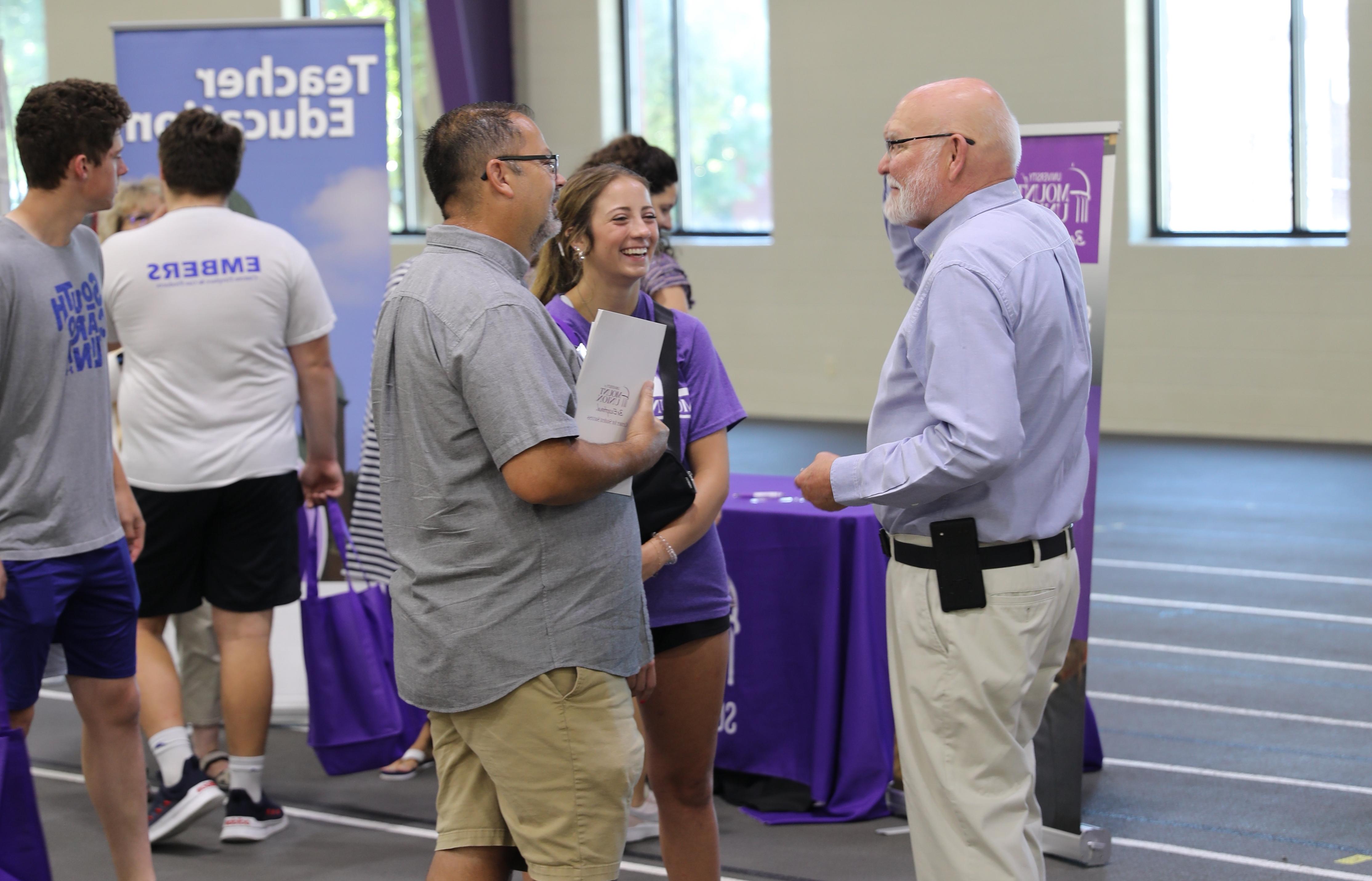 Faculty meeting with family at Preview